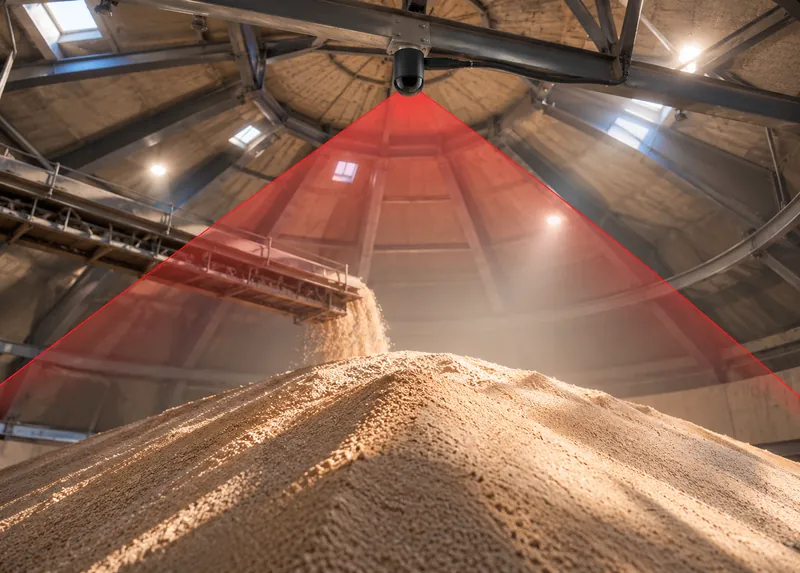 Overhead sensor above a round bunker with a red scan fan over the pile