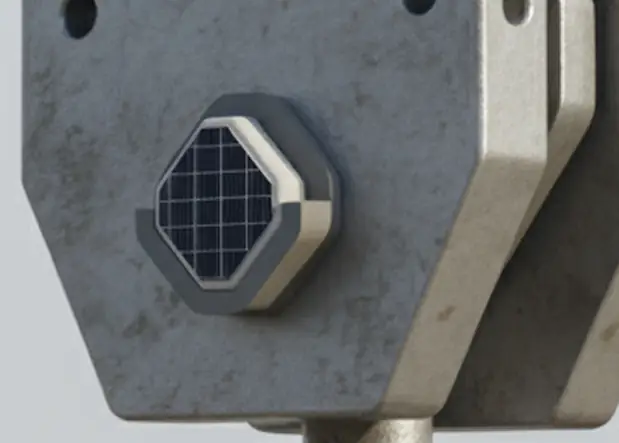 Industrial safety sensor device mounted on heavy construction equipment featuring protective grid and durable metal housing for construction site safety