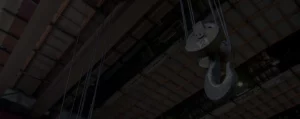 Overhead crane lifting hook used in industrial facility for heavy equipment safety and EHS compliance