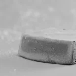 Hesai AT128 LiDAR sensor covered in dust showcasing rugged design for harsh outdoor environments