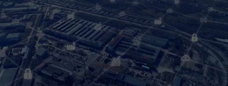 Aerial view of industrial facility with IoT-enabled battery management system network overlay showing connected infrastructure