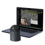 CRATUS dome LiDAR sensor beside a laptop running the Nx Go smart city perception platform with live multi-camera traffic analytics and GIS mapping