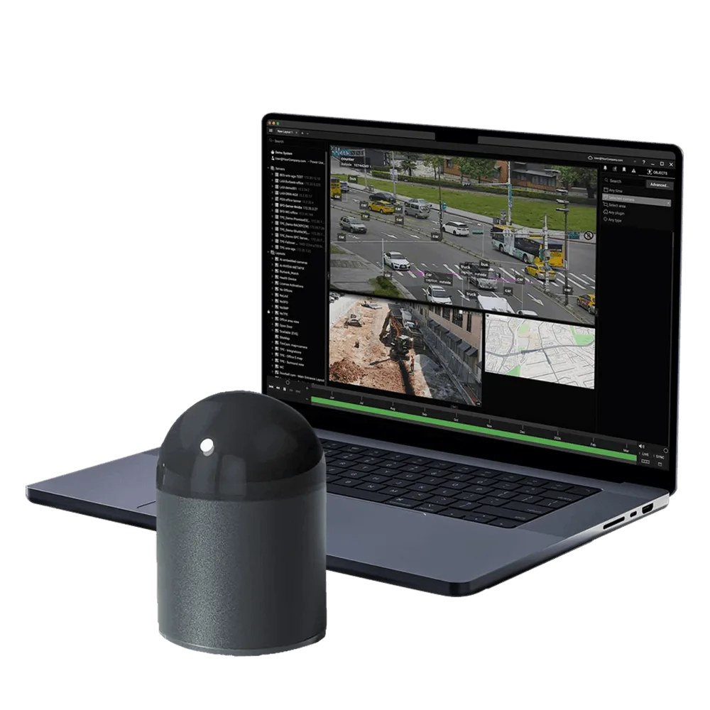 CRATUS dome LiDAR sensor beside a laptop running the Nx Go smart city perception platform with live multi-camera traffic analytics and GIS mapping