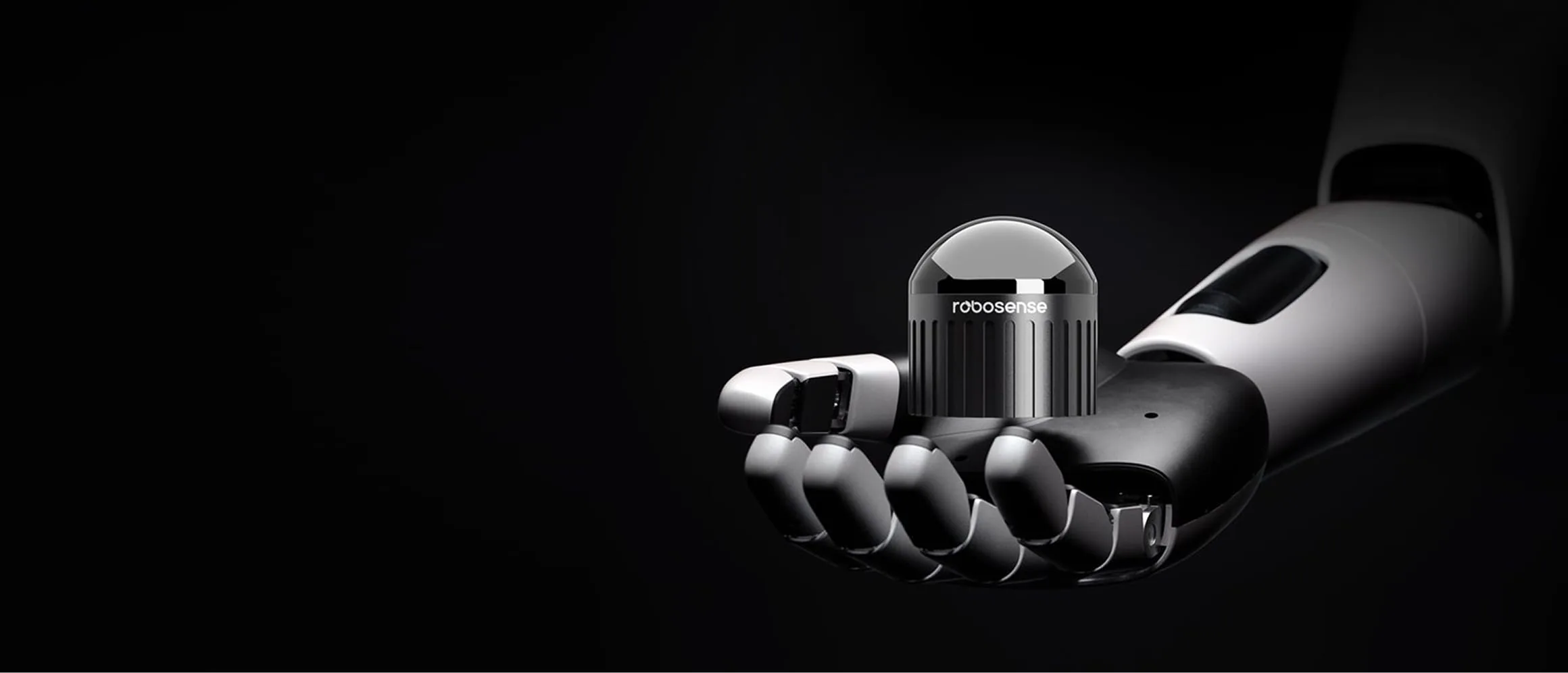 RoboSense Airy hemispherical LiDAR held in a robotic hand showing its palm-sized 60 millimetre body