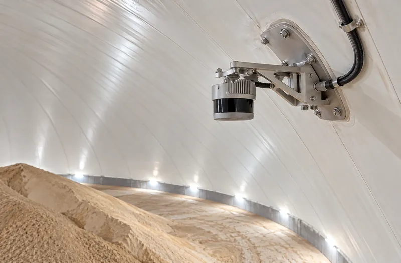 LiDAR sensor mounted on the inside wall of a white storage dome